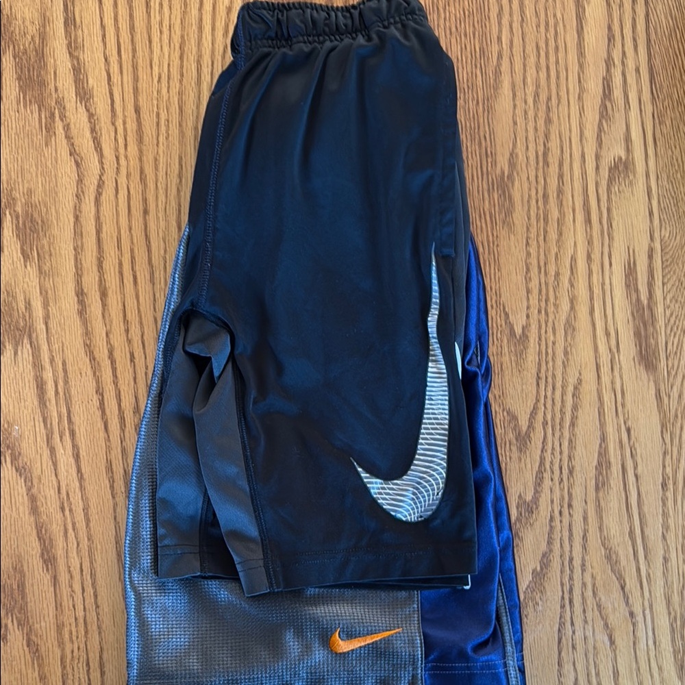 Nike Kids Black and Blue Shorts with Orange Logo